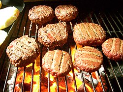 Burgers cooking on a grill